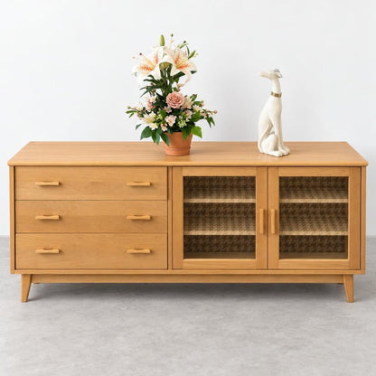 Wooden sideboard with drawers, glass doors, floral arrangement, and dog statue.
