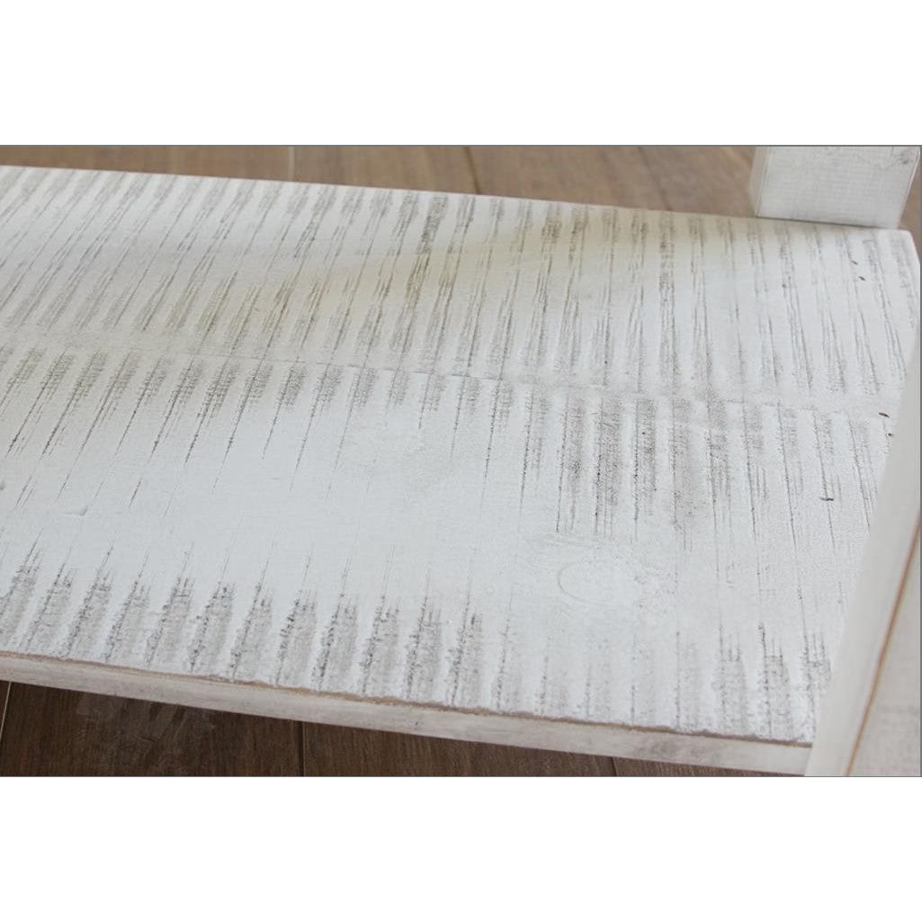 Close-up of a textured wooden surface with rustic, whitewash finish.
