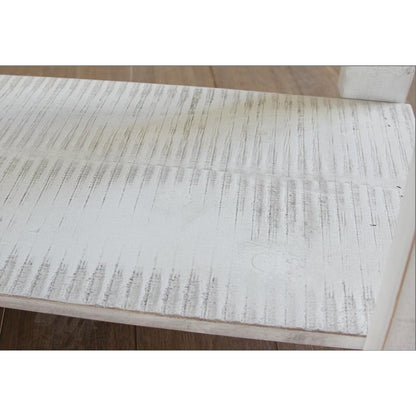 Close-up of a textured wooden surface with rustic, whitewash finish.