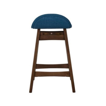 Wooden stool with blue cushioned seat.