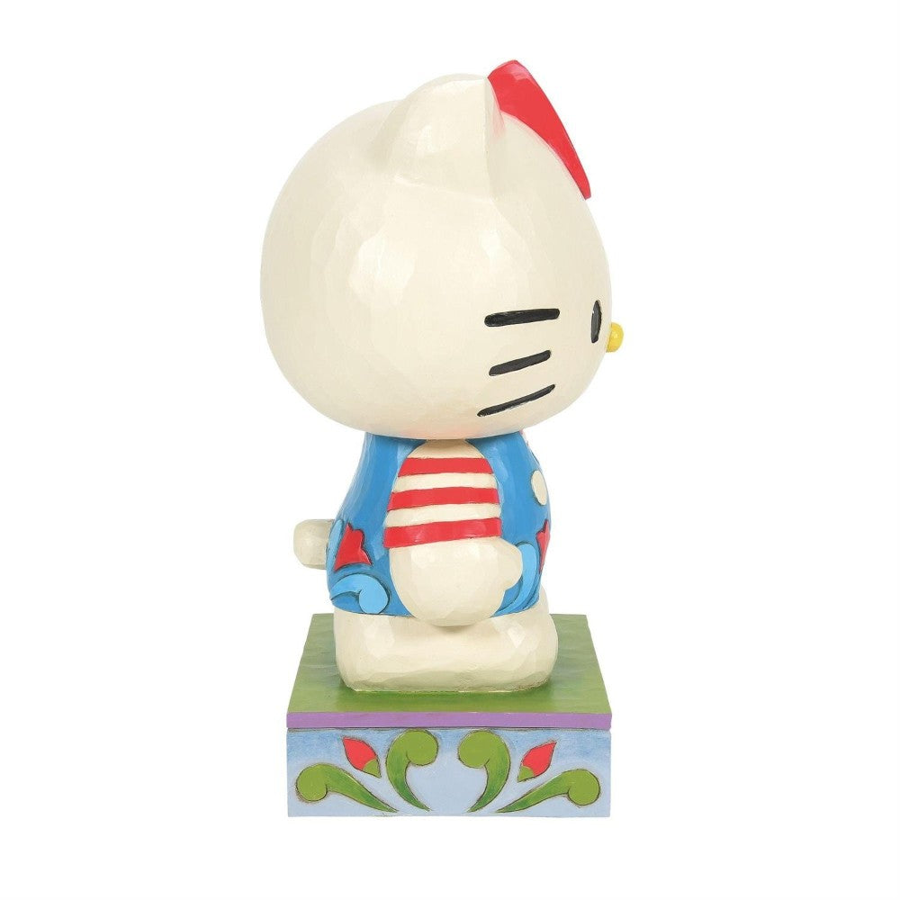 Hello Kitty figurine in colorful attire, side view.