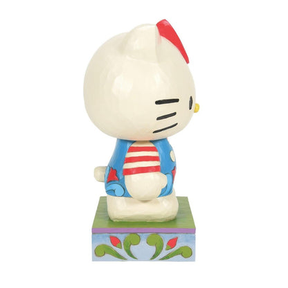 Hello Kitty figurine in colorful attire, side view.