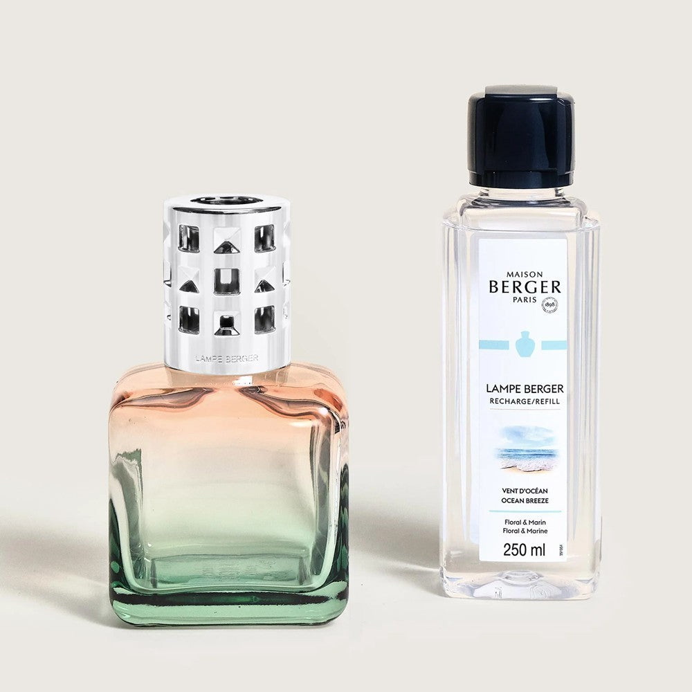 Two Lampe Berger air freshener bottles with sleek designs.