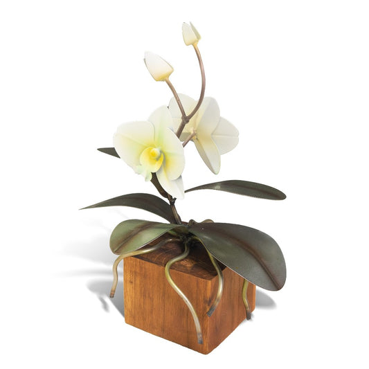 Metal sculpture of an orchid on a wooden base.