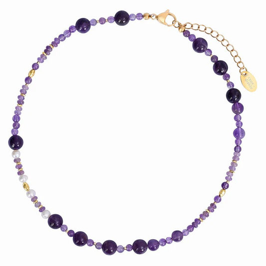 Purple beaded necklace with gold accents and adjustable clasp.