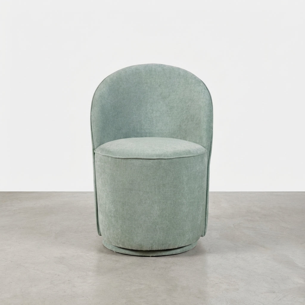 Sleek, modern green swivel chair with a minimalist design and rounded backrest.