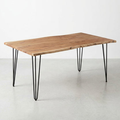 Wooden table with a natural edge and metal hairpin legs.