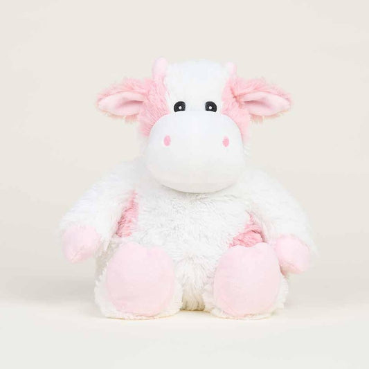 Fluffy pink and white cow plush toy.