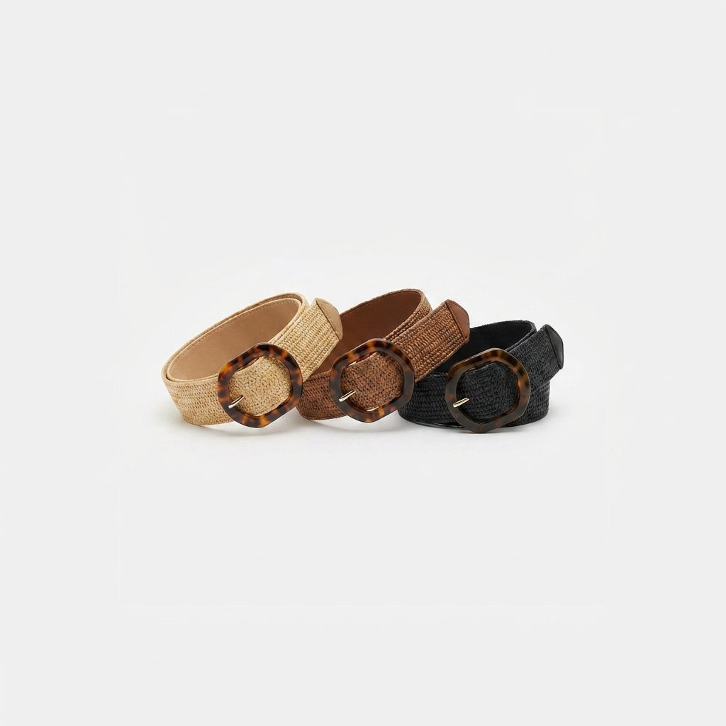 Three woven belts with tortoiseshell buckles in beige, brown, and black.