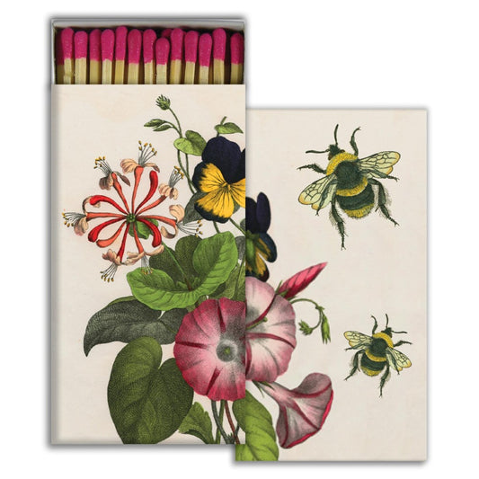 Box of matches with illustrated flowers and bees.