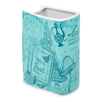 Blue mug with Alice in Wonderland theme and whimsical illustrations.