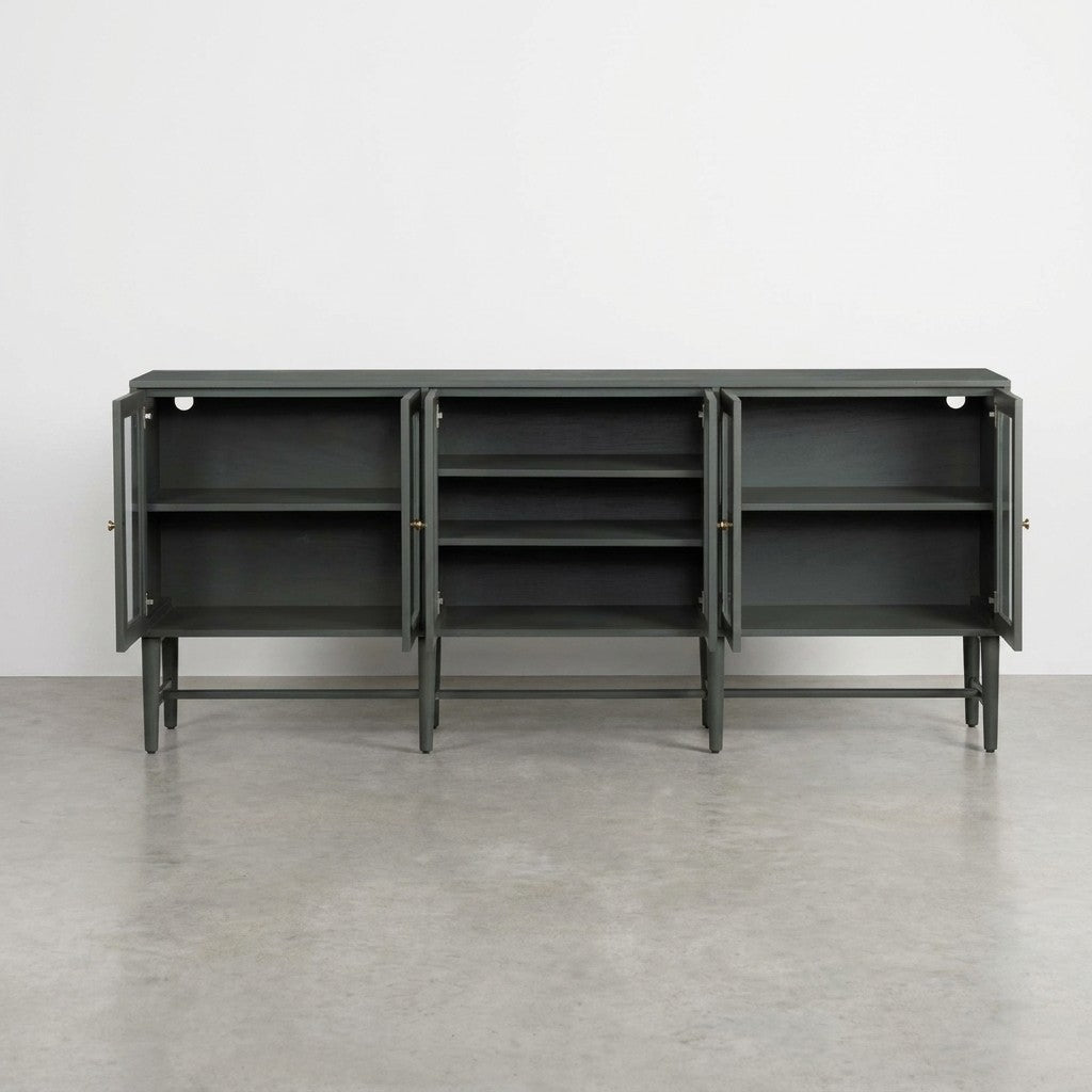 Green cabinet with glass doors and interior shelves.