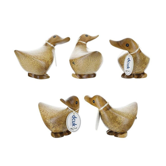Five carved wooden ducks with tags, positioned in a group.