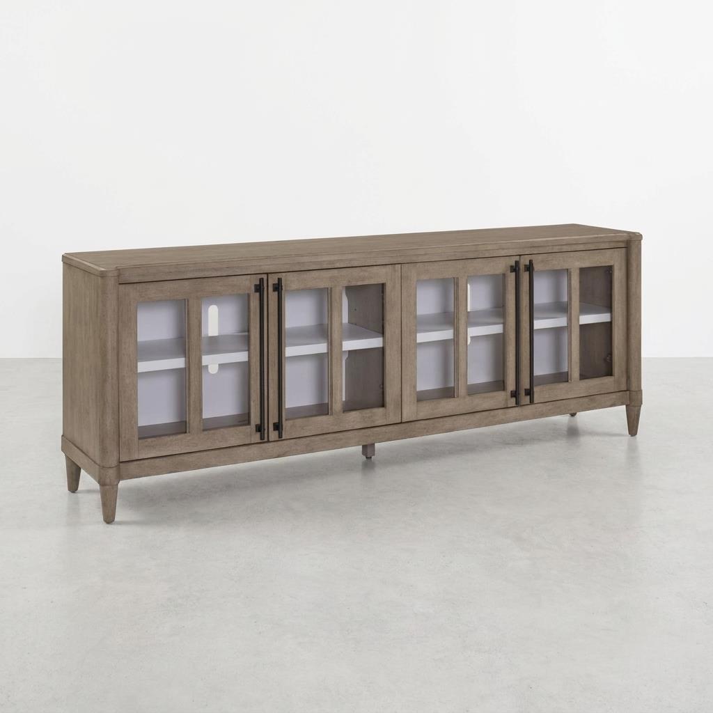 Wooden sideboard with glass doors and black handles.