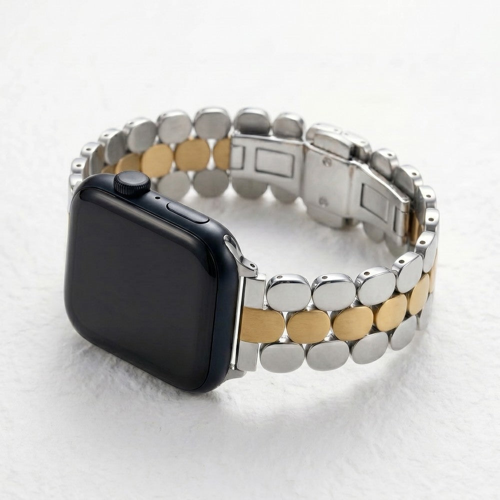 Smartwatch with black face and two-tone metal band on a white surface.
