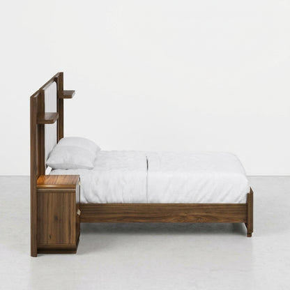 Wooden bed with integrated shelves and white bedding.