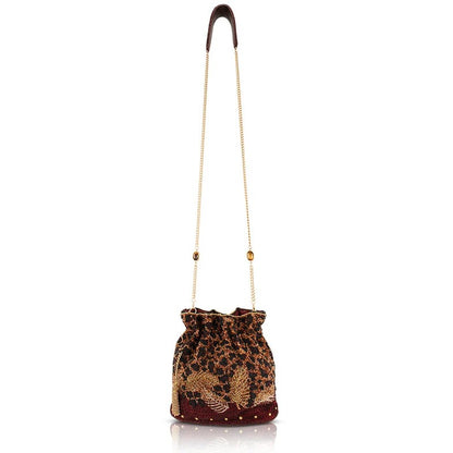 Embroidered drawstring bag with a gold chain strap.