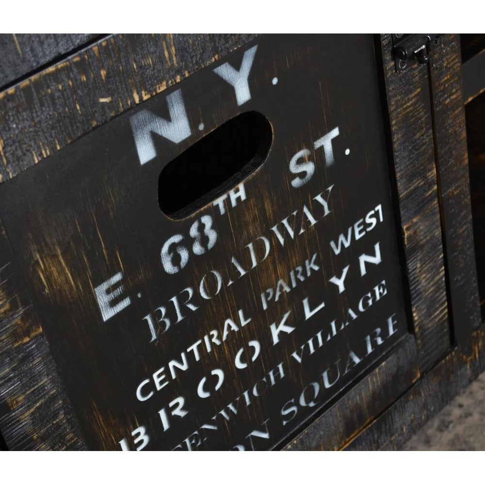 Rustic wooden crate with N.Y. street names in white lettering.