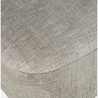 Close-up of gray textured fabric on a curved surface.