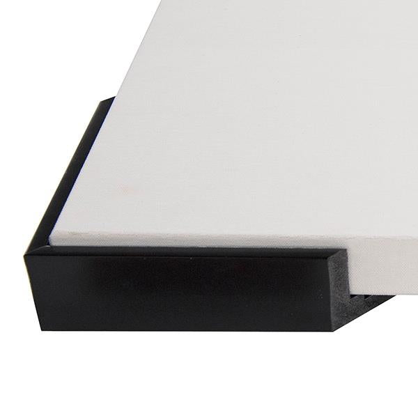 Close-up of a black floater frame with a white canvas insert.