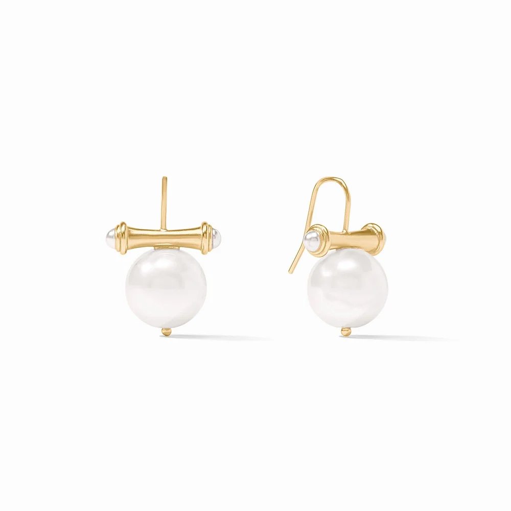 Pair of gold-tone earrings featuring large white pearls and sculptural bar-style settings.