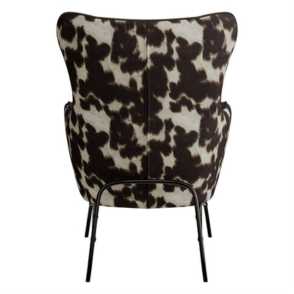 Cow print chair with black metal legs, viewed from the back.