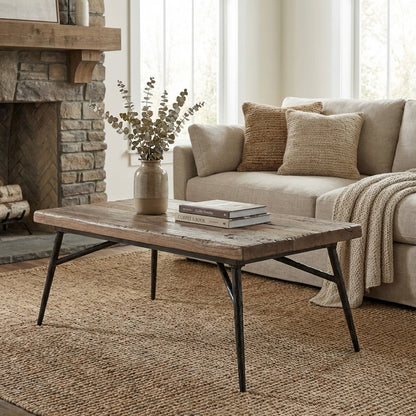 Wooden table with black metal legs, industrial style.