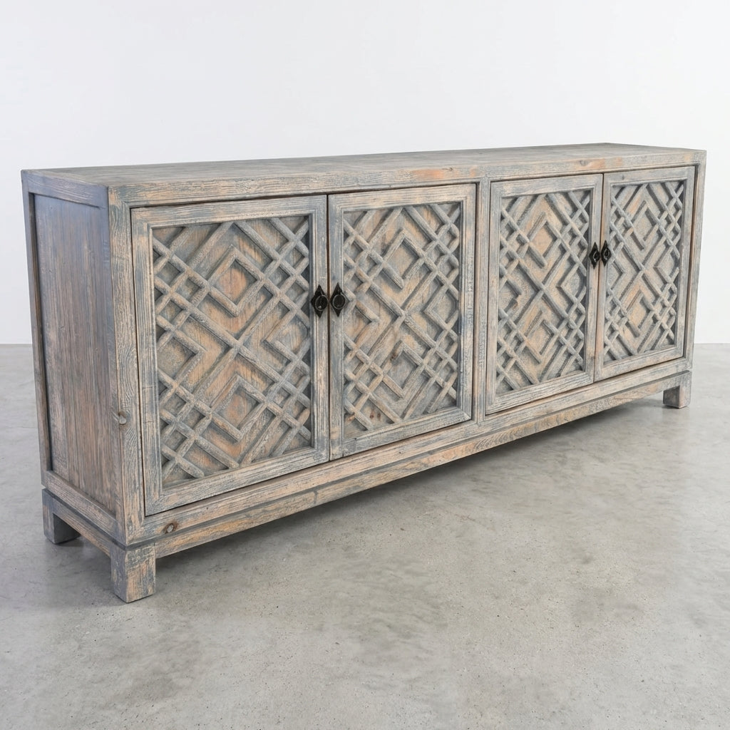 Rustic sideboard with carved doors and open shelves.