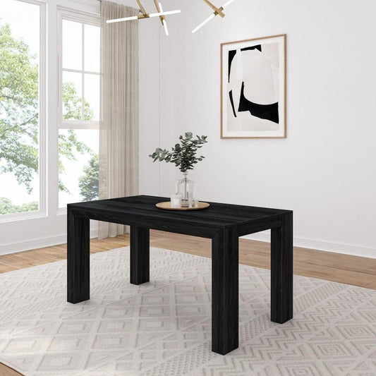 Minimalist dining room with black table and abstract art.