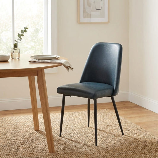 Modern blue chair with slim, black legs.