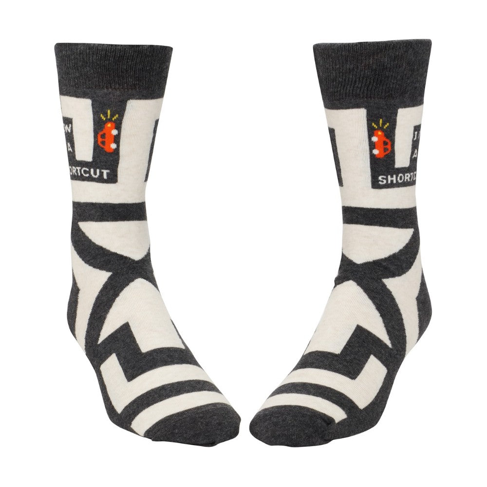 Black and white socks with playful patterns and text.