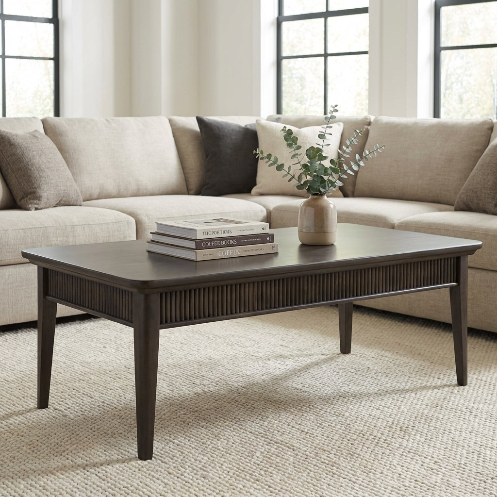 Dark wooden rectangular coffee table with tapered legs.