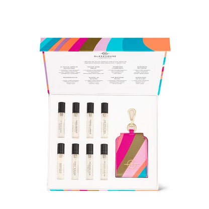 Colorful perfume sampler set with eight vials and a striped keychain.