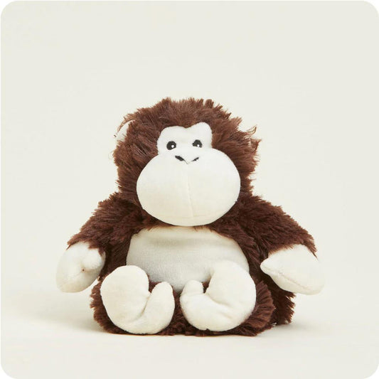 Plush brown and white monkey toy on a plain background.