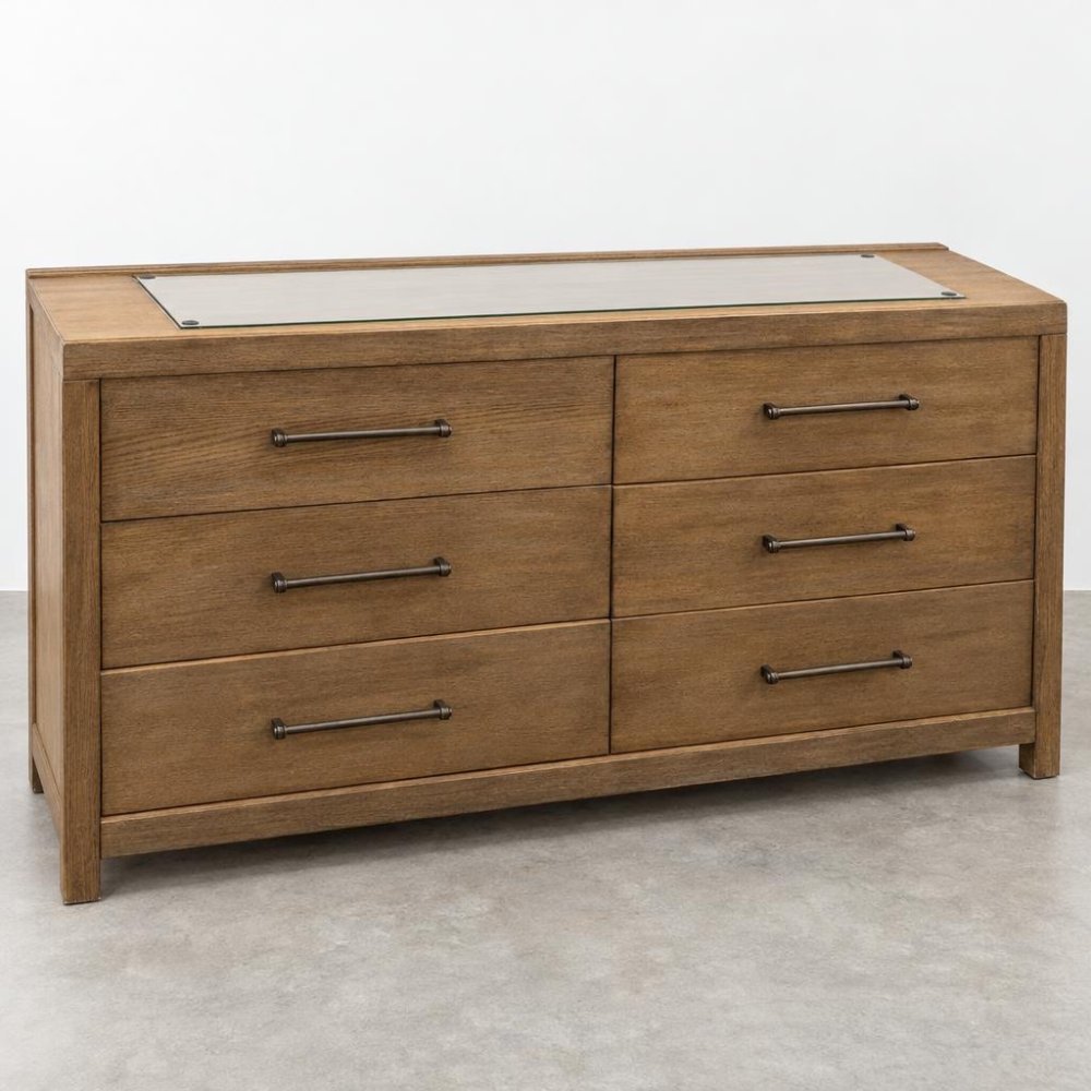A wooden dresser with six drawers, metal handles, and a glass inset top.