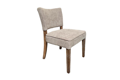 Beige upholstered chair with wooden legs.