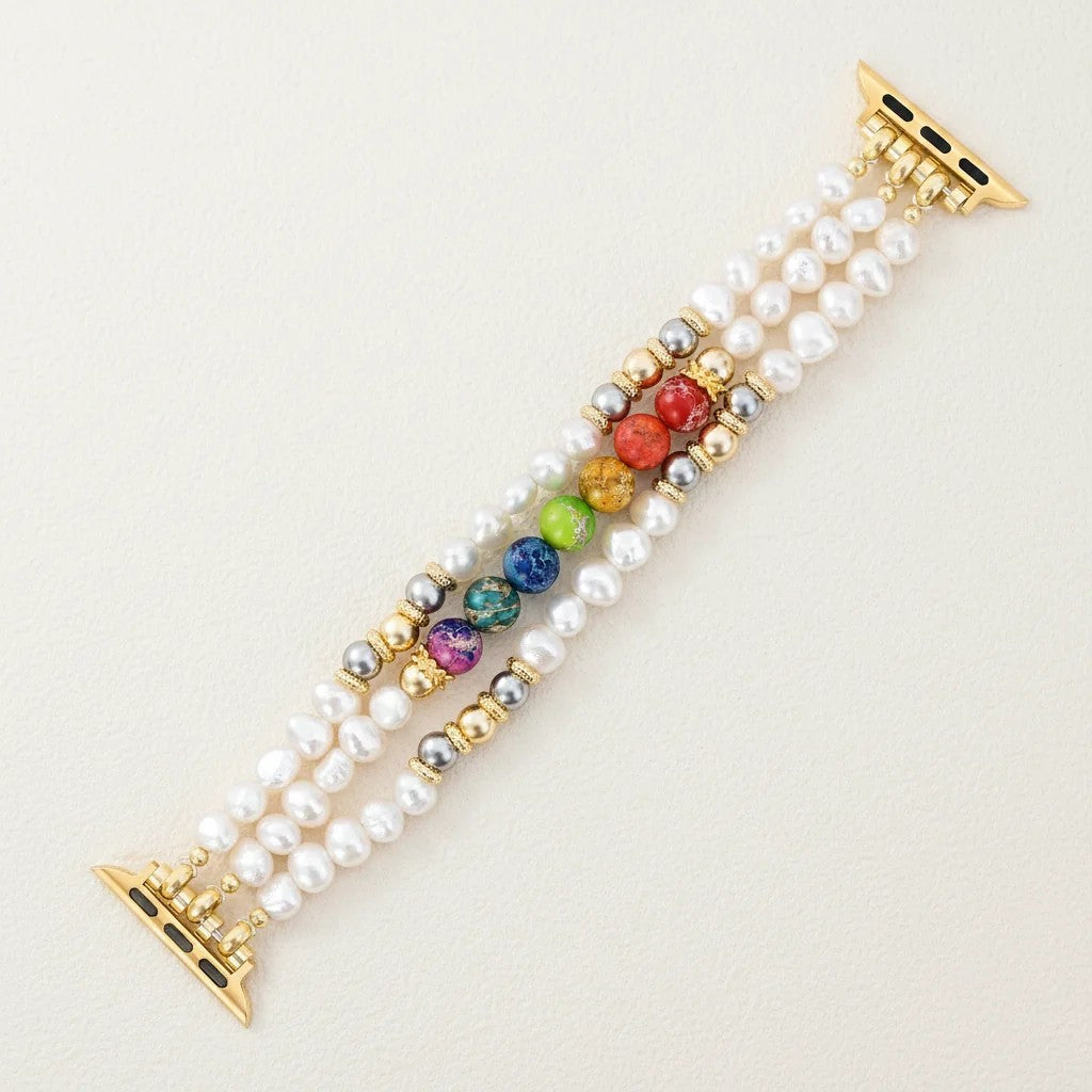 Elegant multicolored bead bracelet with gold accents and pearl details.