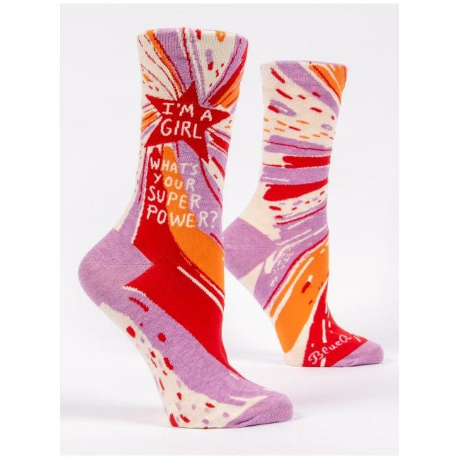 Colorful socks with empowering text and abstract design.