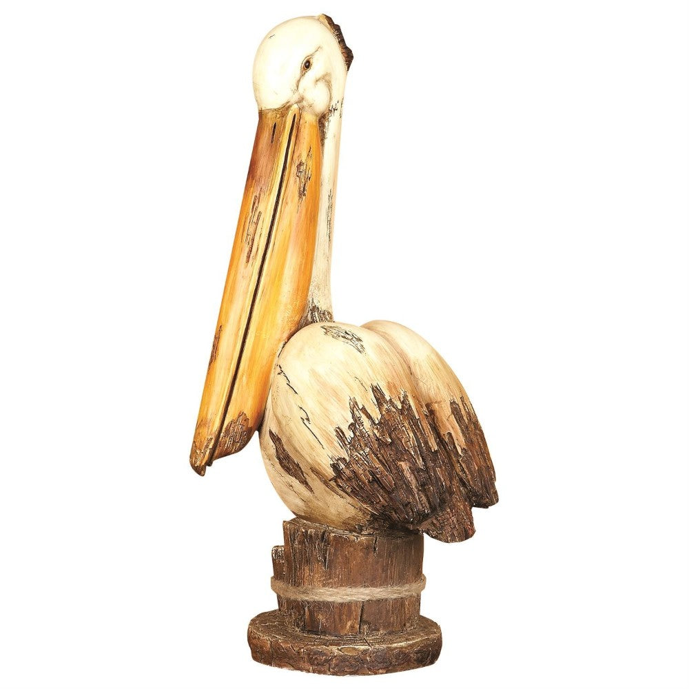 Wooden pelican sculpture with a rustic finish on a white background.