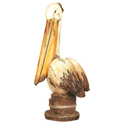 Wooden pelican sculpture with a rustic finish on a white background.