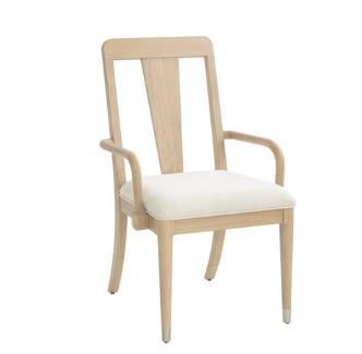Wooden chair with a white cushioned seat and backrest.