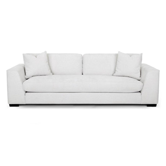 White sofa with two cushions on each side.