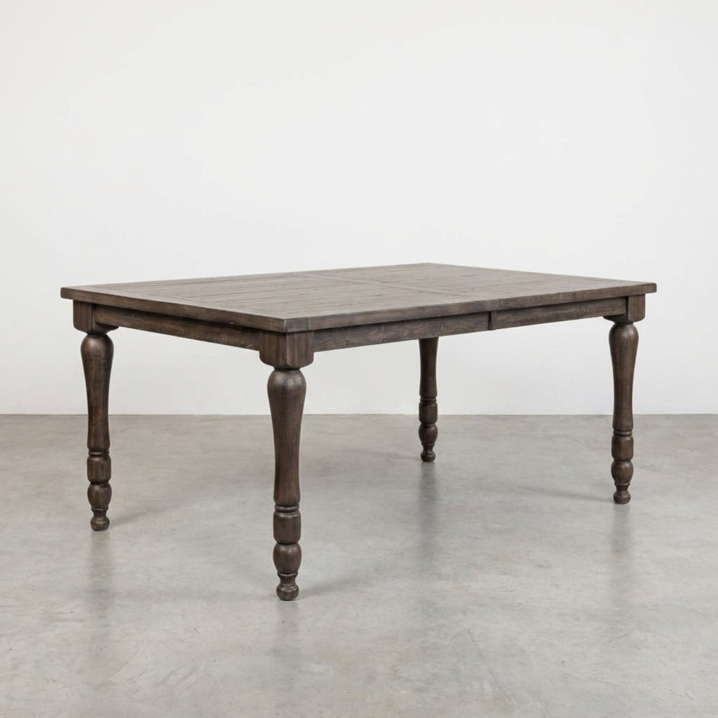 Rustic wooden table with intricately carved legs.