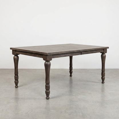 Rustic wooden table with intricately carved legs.