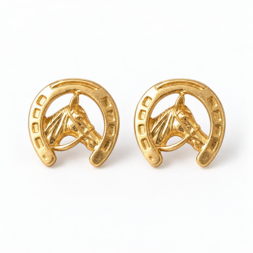 Gold horse and horseshoe cufflinks on white background.