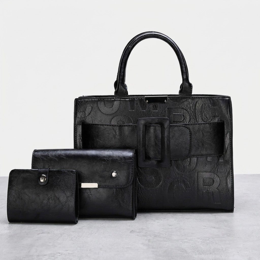 Black leather bag and two matching wallets on display.