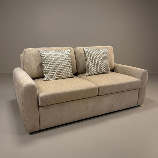 Beige two-seater sofa with cushioned back and armrests.