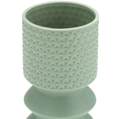 Light green textured ceramic vase, geometric pattern.