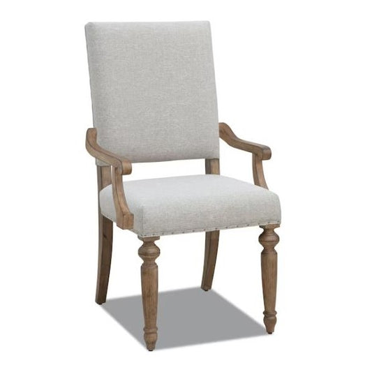 Wooden armchair with beige upholstery and elegant design.