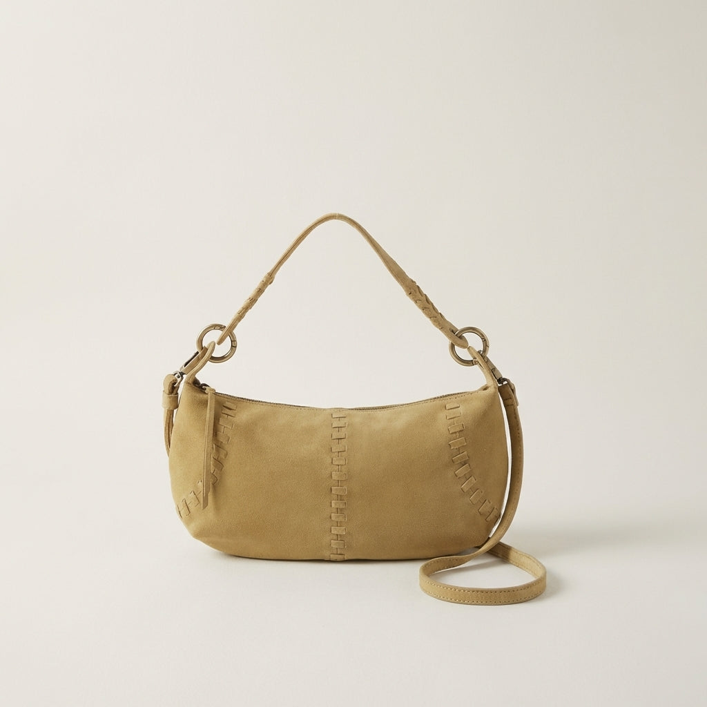 A stylish tan suede handbag with braided and stitched details.